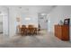 Bright dining room with wood table and chairs near entryway at 4093 River Bank Way, Punta Gorda, FL 33980
