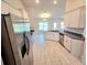 Spacious kitchen featuring stainless steel appliances and light wood cabinets at 9267 Waldrep St, Port Charlotte, FL 33981