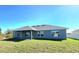 Newly built home with a covered patio and a large backyard at 9267 Waldrep St, Port Charlotte, FL 33981