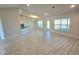 Open living room with tile floors and access to backyard at 9267 Waldrep St, Port Charlotte, FL 33981