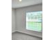 Cozy bedroom with carpeted floor and a window with blinds at 9267 Waldrep St, Port Charlotte, FL 33981