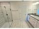 Modern bathroom with a glass shower and granite vanity at 9267 Waldrep St, Port Charlotte, FL 33981