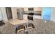 Modern kitchen with stainless steel appliances and granite countertops at 9267 Waldrep St, Port Charlotte, FL 33981