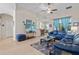 Spacious living room with comfortable seating and a large TV at 24449 Manchester Trl, Punta Gorda, FL 33980
