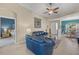 Living room with blue leather sofas and view of Primary bedroom at 24449 Manchester Trl, Punta Gorda, FL 33980