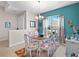 Bright dining area with a round table and colorful chairs at 24449 Manchester Trl, Punta Gorda, FL 33980