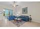 Living room featuring blue leather sofas and a coffee table at 24449 Manchester Trl, Punta Gorda, FL 33980