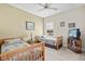 Guest bedroom with two twin beds, a TV, and a window view at 24449 Manchester Trl, Punta Gorda, FL 33980