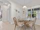 Small breakfast nook with a glass-top table and wicker chairs at 24449 Manchester Trl, Punta Gorda, FL 33980