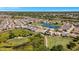 Aerial view showcasing a home's location in a golf course community near a lake at 24449 Manchester Trl, Punta Gorda, FL 33980