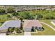 Two-home aerial view, showcasing a community with golf course and water features at 24449 Manchester Trl, Punta Gorda, FL 33980