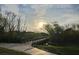 Wooden footbridge over tranquil waterway in a residential area at 24449 Manchester Trl, Punta Gorda, FL 33980