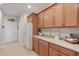 Kitchen features extensive cabinetry and counter space, with a built in refrigerator at 24449 Manchester Trl, Punta Gorda, FL 33980