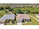 Two-home aerial view, showcasing a community with golf course and water features at 24449 Manchester Trl, Punta Gorda, FL 33980