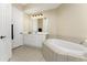 Clean bathroom featuring a large bathtub and vanity at 97 Vivante Blvd # 404, Punta Gorda, FL 33950