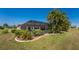 Landscaped backyard with a screened patio and pool at 16446 Belo Ct, Punta Gorda, FL 33955