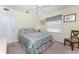 Bedroom with a double bed, ceiling fan, and neutral decor at 16446 Belo Ct, Punta Gorda, FL 33955