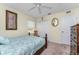Well-lit bedroom with a ceiling fan and neutral decor at 16446 Belo Ct, Punta Gorda, FL 33955