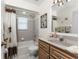 Guest bathroom with tub/shower combo and updated vanity at 16446 Belo Ct, Punta Gorda, FL 33955