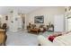 Bright living room with tiled floors, comfortable seating, and decorative accents at 16446 Belo Ct, Punta Gorda, FL 33955