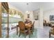 Charming dining room with wood table and chairs, and large window at 16446 Belo Ct, Punta Gorda, FL 33955