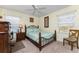 Cozy bedroom with light teal bedding and wooden furniture at 16446 Belo Ct, Punta Gorda, FL 33955