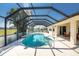 Inviting screened pool area with a relaxing patio at 16446 Belo Ct, Punta Gorda, FL 33955