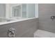 Shower stall with gray tile and built-in seat at 8191 Strasse Blvd, Punta Gorda, FL 33982