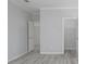 Bedroom with hardwood floors and access to bathroom at 8191 Strasse Blvd, Punta Gorda, FL 33982