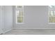 Bright bedroom with hardwood floors and large windows at 8191 Strasse Blvd, Punta Gorda, FL 33982