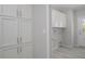 Laundry room with ample cabinet space and flooring at 8191 Strasse Blvd, Punta Gorda, FL 33982
