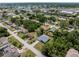 Aerial view of neighborhood homes, showcasing the home's location near a lake at 2049 Delta St, Port Charlotte, FL 33952