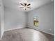 Bedroom featuring neutral walls, tile floor, ceiling fan, and natural light at 2049 Delta St, Port Charlotte, FL 33952
