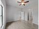 Bedroom featuring neutral walls, tile floor, ceiling fan, and multiple closets at 2049 Delta St, Port Charlotte, FL 33952
