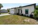 Beautiful single story home with an attached garage and well manicured landscaping at 2049 Delta St, Port Charlotte, FL 33952