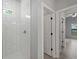 Walk-in shower with white subway tile, neutral paint, and tile flooring at 2049 Delta St, Port Charlotte, FL 33952