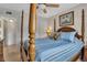 Comfortable bedroom with a post bed and closet at 3310 Loveland Blvd # 1502, Punta Gorda, FL 33980