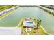 Aerial view of community pool and condo buildings near lake at 3310 Loveland Blvd # 1502, Punta Gorda, FL 33980