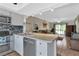 Modern kitchen with stainless steel appliances and breakfast bar at 3310 Loveland Blvd # 1502, Punta Gorda, FL 33980
