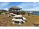 Gazebo with picnic tables and grill overlooking lake at 3310 Loveland Blvd # 1502, Punta Gorda, FL 33980