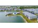 Aerial view of condo community with lake and pool at 3310 Loveland Blvd # 1502, Punta Gorda, FL 33980
