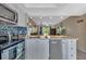 Modern kitchen with stainless steel appliances and breakfast bar at 3310 Loveland Blvd # 1502, Punta Gorda, FL 33980
