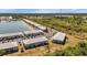 Aerial view of a waterfront community with multiple buildings and parking at 3310 Loveland Blvd # 1502, Punta Gorda, FL 33980