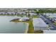 Aerial view of an apartment community with a pool and lake access at 3310 Loveland Blvd # 1502, Punta Gorda, FL 33980