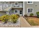 Condo building entrance with well-maintained landscaping and walkway at 3310 Loveland Blvd # 1502, Punta Gorda, FL 33980