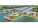 Aerial view of a waterfront community with a pool and a gazebo at 3310 Loveland Blvd # 1502, Punta Gorda, FL 33980