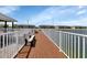 Dock with benches offering scenic lake views at 3310 Loveland Blvd # 1502, Punta Gorda, FL 33980