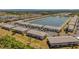 Aerial view of a lakefront community with numerous buildings and lush landscaping at 3310 Loveland Blvd # 1502, Punta Gorda, FL 33980