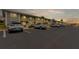 Exterior view of condo building with ample parking and landscaping at 3310 Loveland Blvd # 1502, Punta Gorda, FL 33980