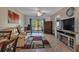 Living room features fireplace, seating, and patio access at 3310 Loveland Blvd # 1502, Punta Gorda, FL 33980